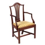 A 19th century mahogany elbow open armchair with pierced back splat, drop-in seat, on tapering