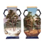 A pair of continental hexagonal form pottery vases decorated with landscapes, each 27cms high (2) (