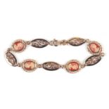 A 9ct gold bracelet, each link inset with a small carved shell cameo, 7.1g.