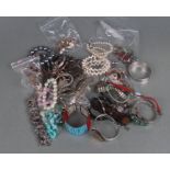 A quantity of assorted costume jewellery to include bracelets, bangles and similar items.