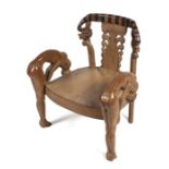 A French Egyptian Revival occasional chair with pierced splat and snake crest rail with naked maiden