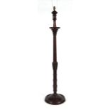 A carved and turned mahogany Corinthian column type standard lamp.