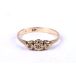 A 9ct gold three stone diamond ring, approx UK size 'O', 1.2g.