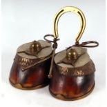 Taxidermy. A late 19th century double horse hoof desk stand with twin inkwells, horse shoe pen