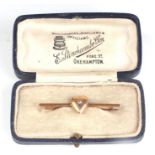 A 19th century 15ct gold heart bar brooch set with a single diamond, boxed.