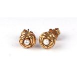 A pair of 18ct gold and pearl stud earrings. 2.5g