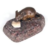 A French bronze figure of a mouse eating a lump of cheese on a figured pink granite base, 10cms