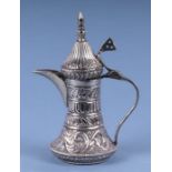 A Turkish / Islamic white metal miniature dallah coffee pot, 12cms high, 109g.