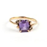 A 9ct gold dress ring set with a large square pink stone and diamond set shoulders, approx UK