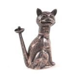 An Edwardian novelty table cigar lighter in the manner of Louis Wain depicting a seated cat,
