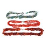 A six-strand salmon coral necklace; together with an amber bead necklace, 88g; and a turquoise