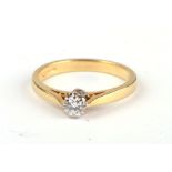 An 18ct gold diamond solitaire ring, approx UK size 'L', 3g.