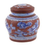 A Chinese Yixing tea caddy decorated with flowers, impressed character mark to base, approx 15cms