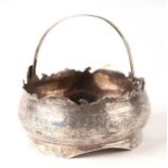 A Chinese white metal bowl with swing handle, decorated with flowers,12cm diameter. 248gCondition