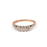 A 9ct gold three stone diamond ring, approx UK size 'L', 2.4g.