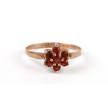 A 9ct gold cluster ring, approx UK size 'M', 1.1g.