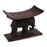 African / Tribal Art. A hardwood stool on elephant support, 50cms wide.