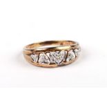 A 9ct gold ring set with diamonds within heart shaped panels, approx UK size 'L', 2g.