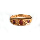 An 18ct gold ruby and diamond half hoop ring, Birmingham 1917, approx UK size 'Q', 3.2g.Condition