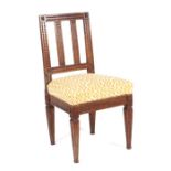 A late Victorian / Edwardian carved walnut occasional chair with overstuffed seat, on carved