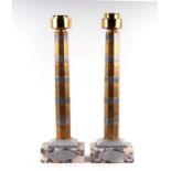 A pair of French table lamps with octagonal damascene style decorated silver and gilded columns,
