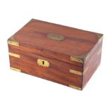 A 19th century mahogany twin-compartment tea caddy with military brass corners and plaque to the