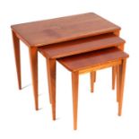 A mid century design Gordon Russell nest of three tables, the largest 61cms wide.