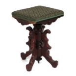 A Victorian walnut rise-and-fall piano stool with upholstered seat.