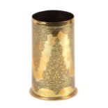 A WWI trench art brass shell case with engraved Persian type decoration, 15ms high.