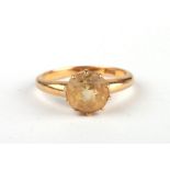 An 18ct gold citrine solitaire ring. Approx. UK size R. 4.7g