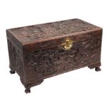 A Chinese profusely carved camphorwood trunk, 102cms wide.
