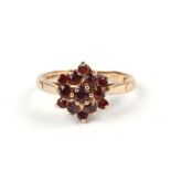 A 9ct gold garnet cluster ring, approx UK size 'O', 3.3g.