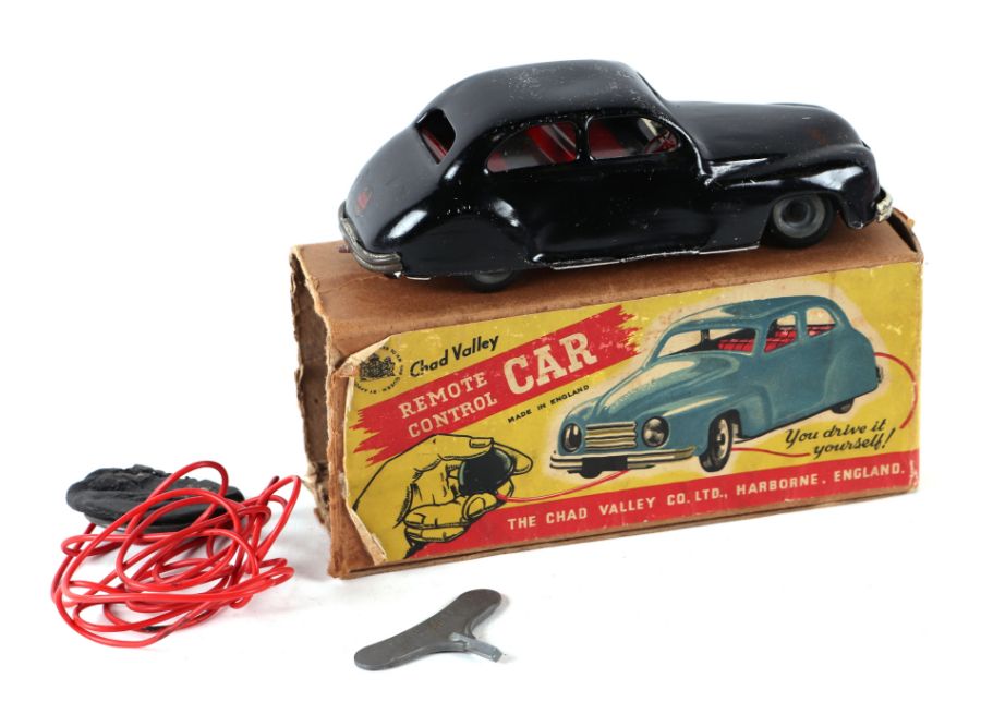 A Chad Valley remote control car, boxed, 19cms long.