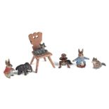 A small group of antique miniature Vienna cold painted bronzes including a cat sat on a chair and