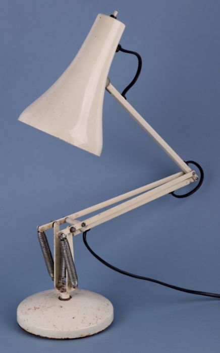 A Hebert Terry Anglepoise lamp on a circular base.