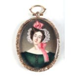 An early Victorian portrait miniature depicting a lady wearing a green dress, in a gilt frame with