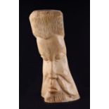 African / tribal art - An African tribal carved bone bust depicting a man, 33cms high.