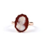 A Victorian yellow metal hardstone cameo ring carved with a profile of a lady, approx UK size 'L'.