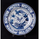 A Chinese blue & white shallow dish decorated with birds and fruit, 37cms diameter.