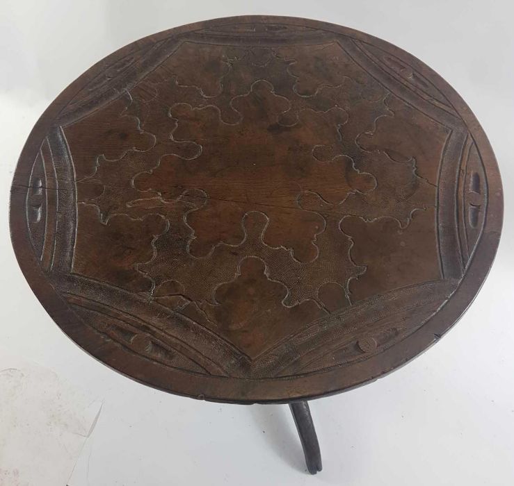 A 18th century tilt top table, with a carved top,