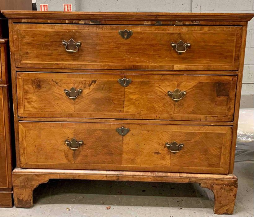 A 19th century walnut and mahogany chest of drawer