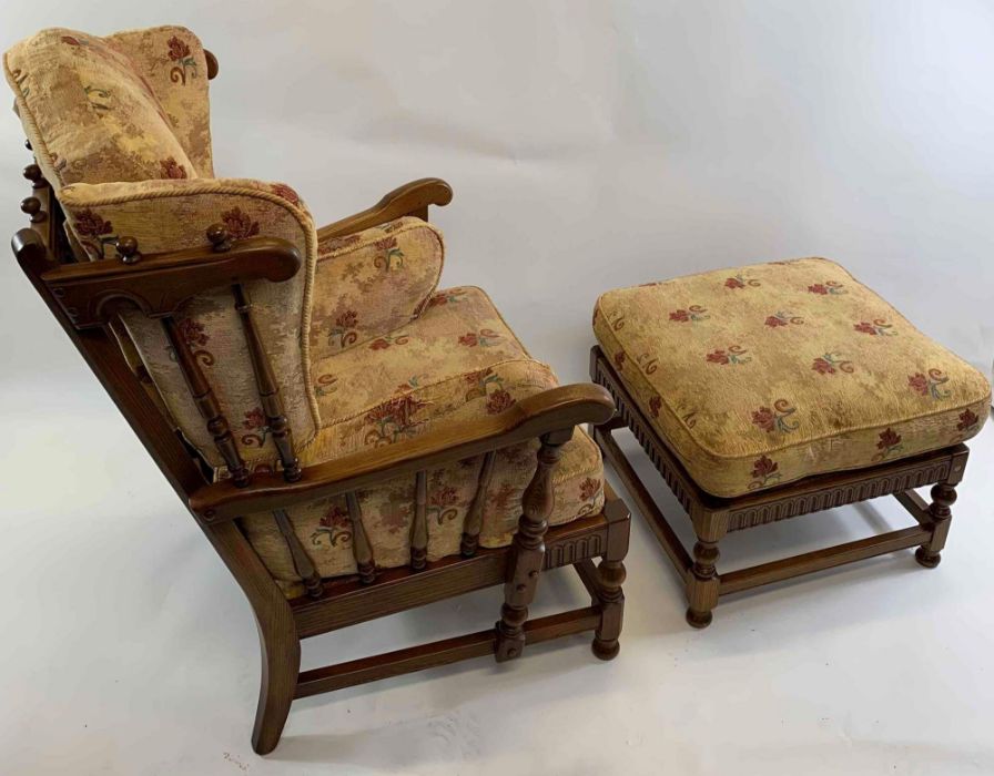 An Ercol open armchair and matching stool