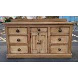 A Victorian pine dresser base, with eight short dr