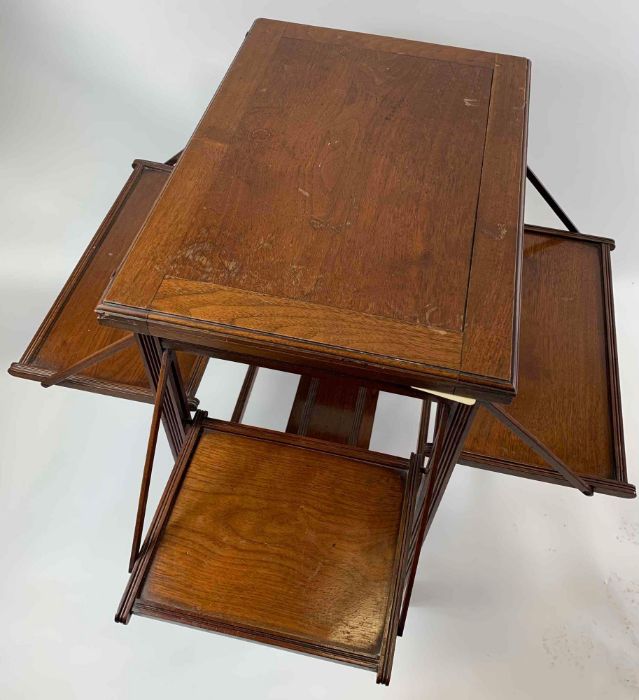 A mahogany games table, with four pull out section
