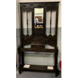 A 20th century carved oak hall stand with a single