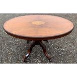 A Victorian walnut inlaid loo table, on four splay