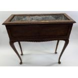 A 19th century mahogany plant trough on stand, wit