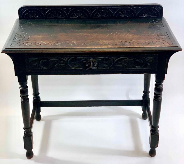 A Victorian carved oak sideboard, with single long