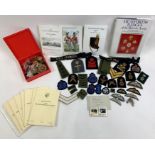 A collection of various military badges to include