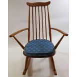 An Ercol beech and elm rocking chair